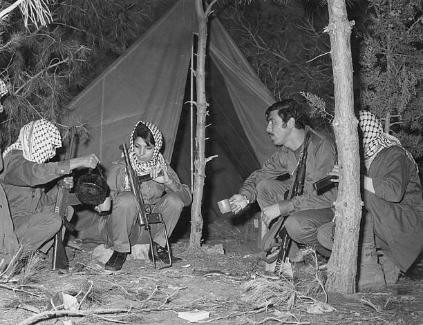 Members of Palestinian terrorist group the Popular Front for the Liberation of Palestine (PFLP) drinking tea during a training excercise, circa 1969. Among the group are Leila Khaled (centre, left) and Salim Issawi